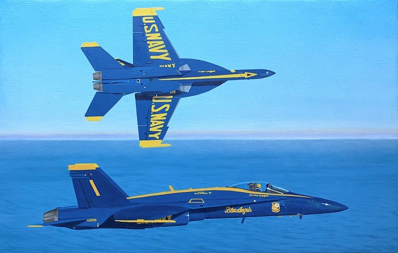 Two blue angels planes one is flying the other is banking away with the words "US Navy" on the wings