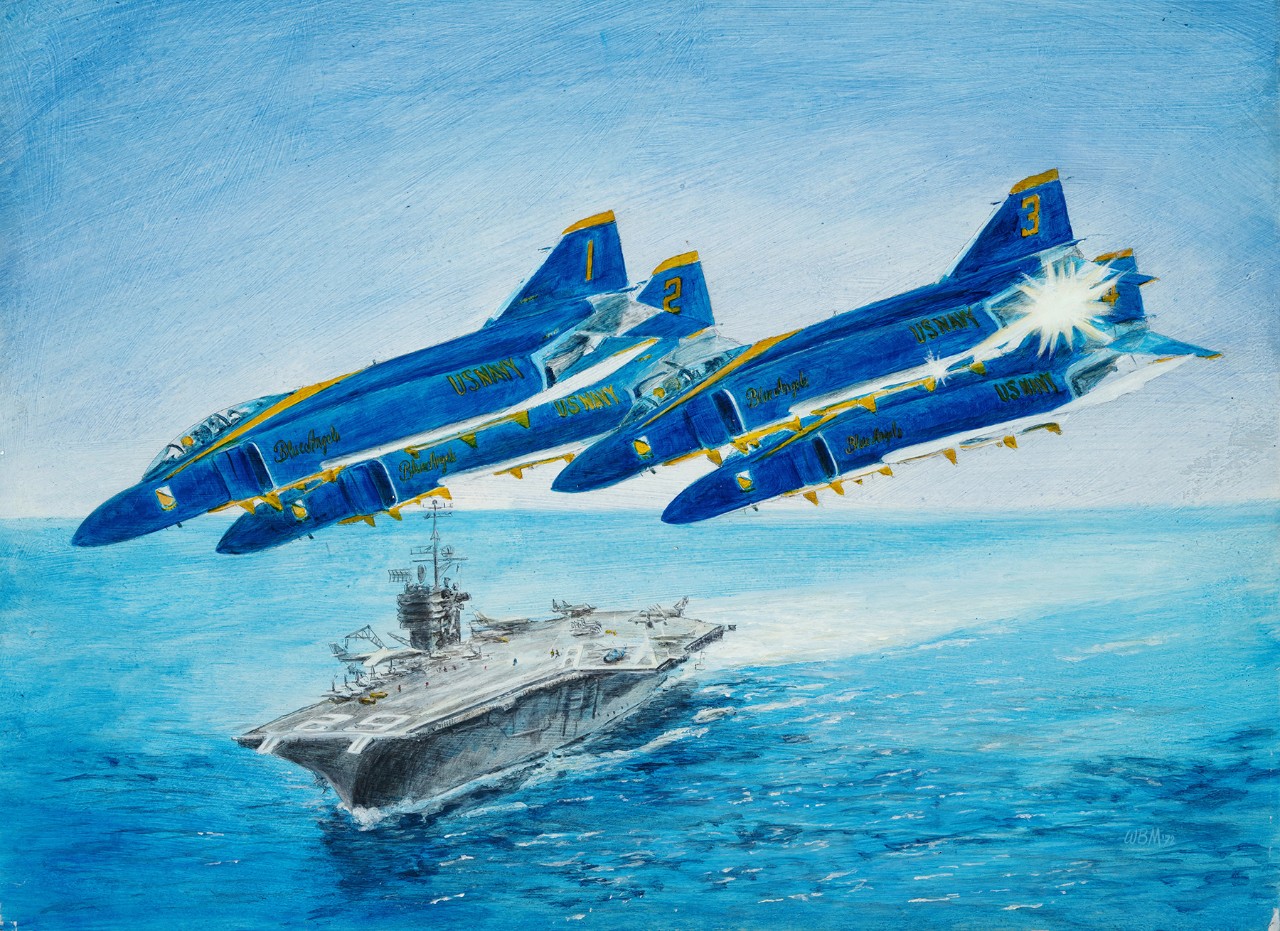 Four Blue Angels flying in formation over USS Independence.