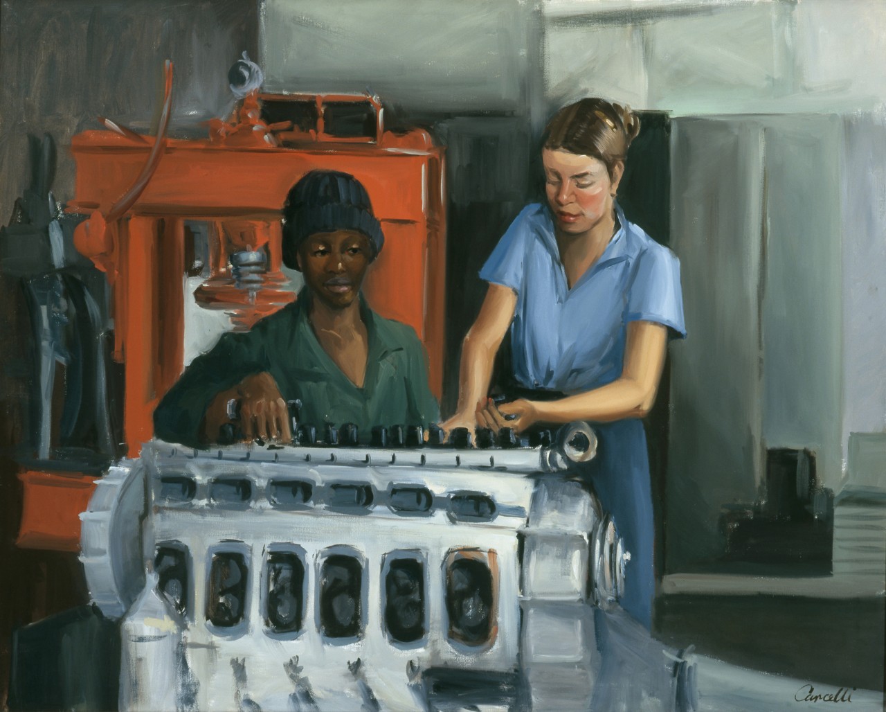Two women working on an engine
