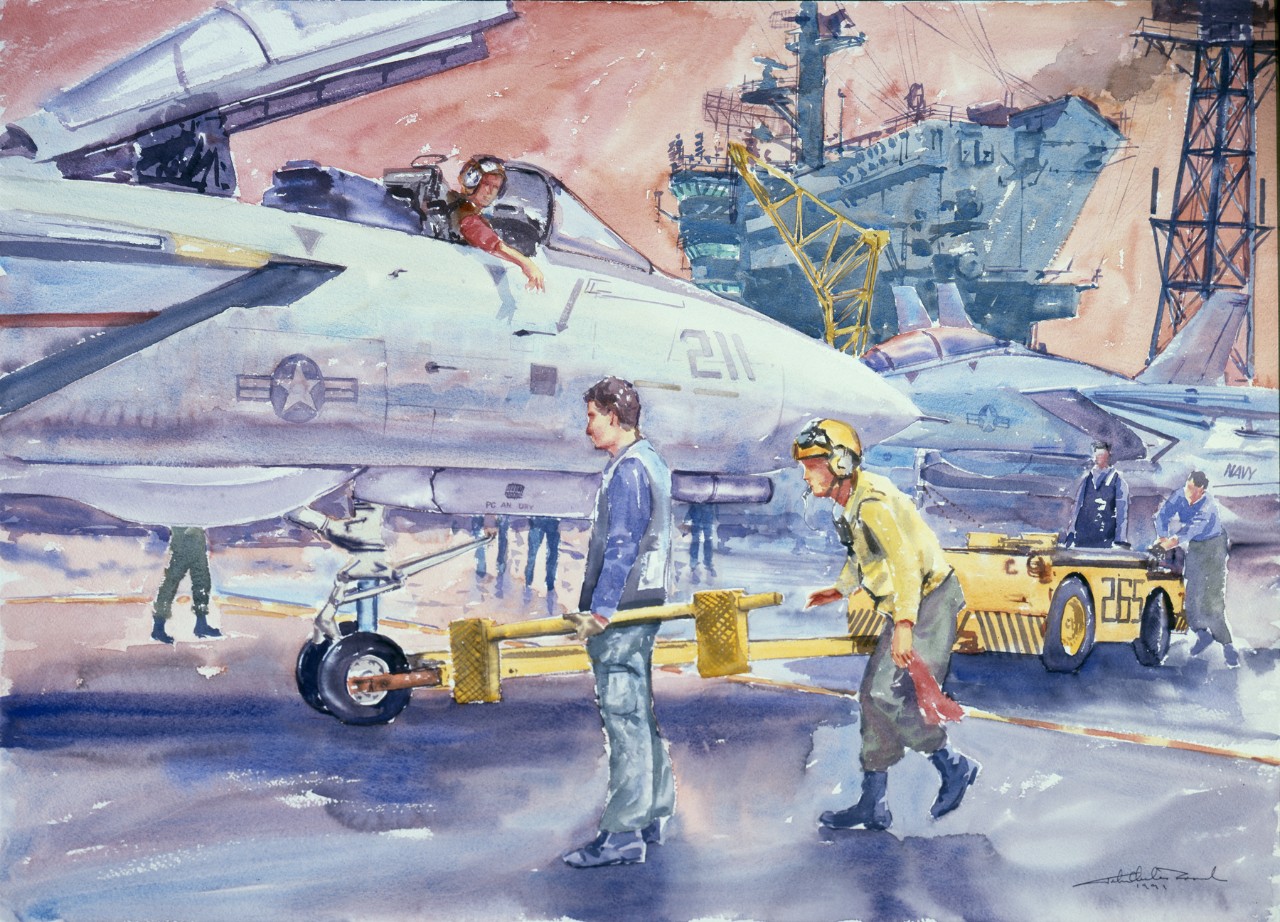 Crewmen on the deck of a aircraft carrier ready a plane