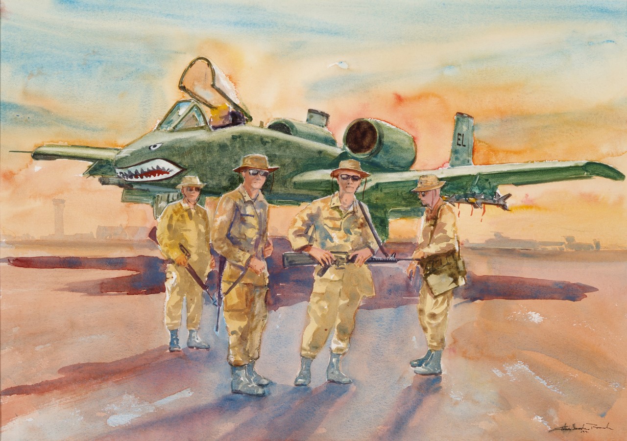 Four soldiers standing in front of an A-10 airplane 