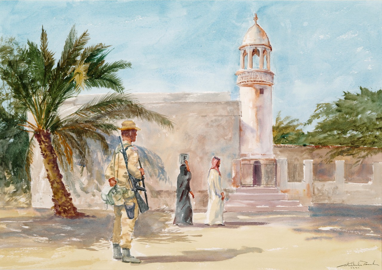 A soldier is standing in front of a mosque