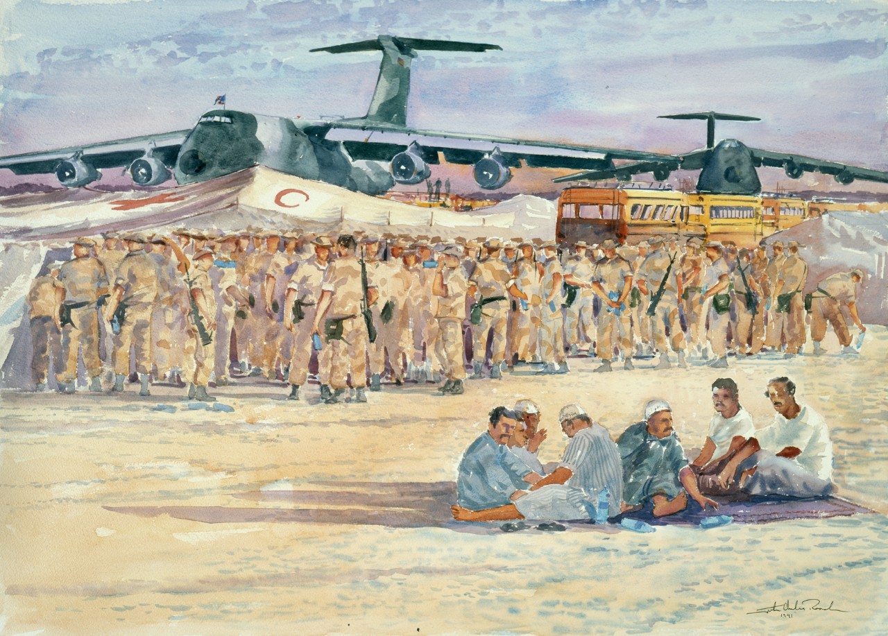 A large group of soldiers standing in front an airplane and tents. A group of civilians are seated on the sand in the foreground