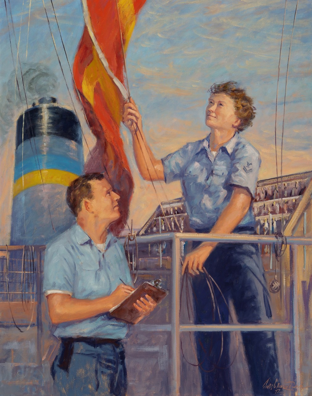 A female sailor raises a signal flag while another sailor holds a clip board