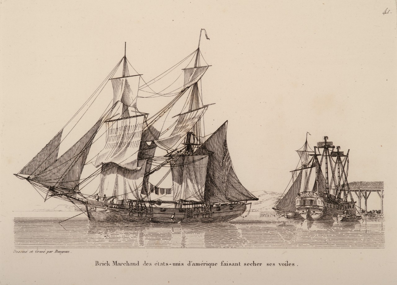 Two sailing ships anchored at a port