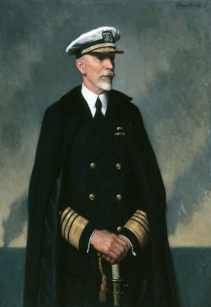 Full length portrait of an admiral wearing his dress blue uniform