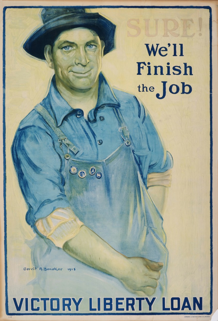 A man wearing overalls and a hat 