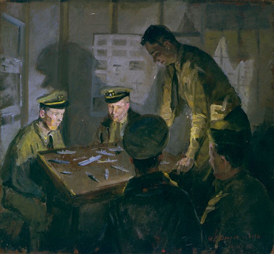 Several officers around a table practice ship identification