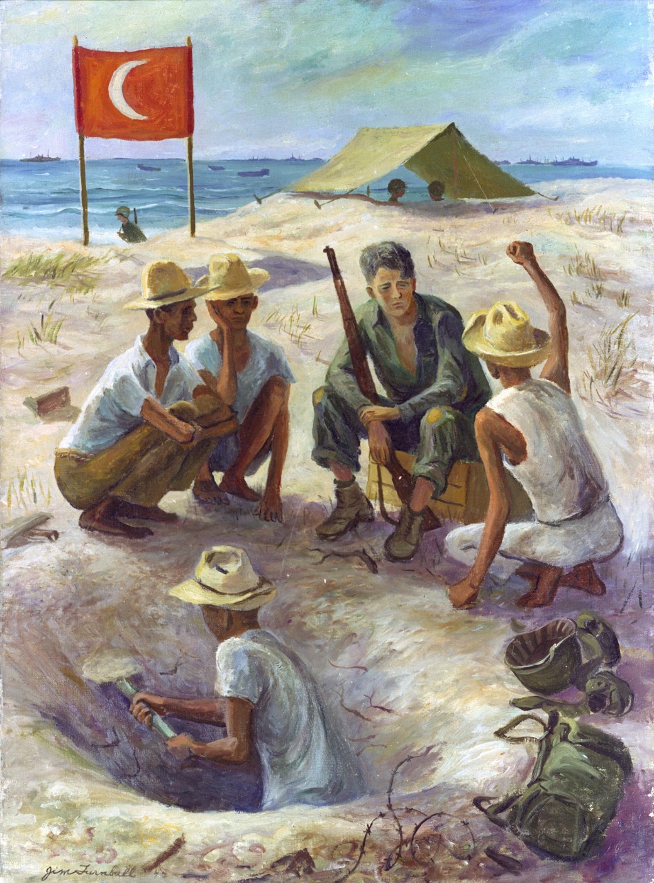 An American soldier with Filipinos on a beach