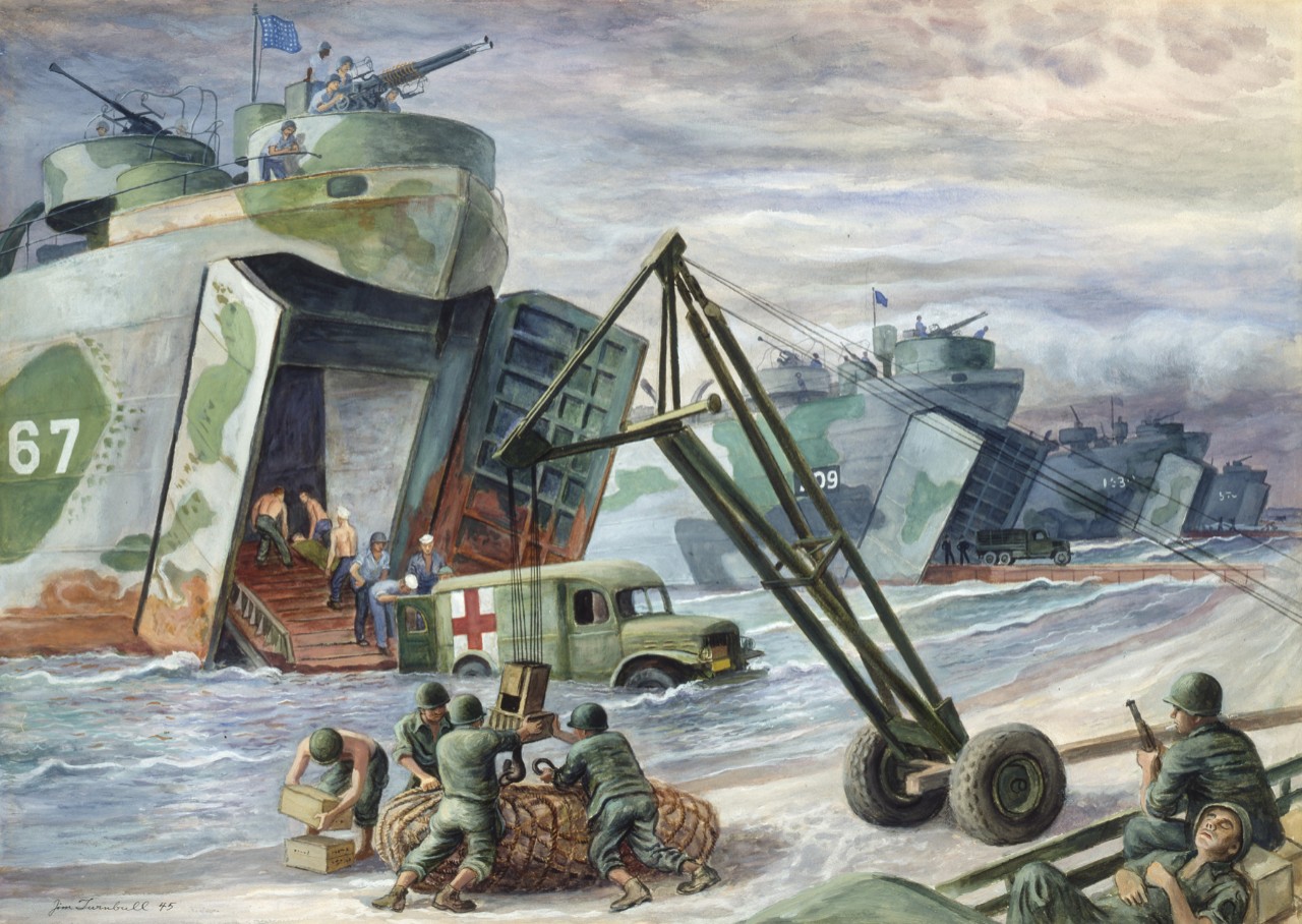 An ambulance unloads the wounded into a landing craft
