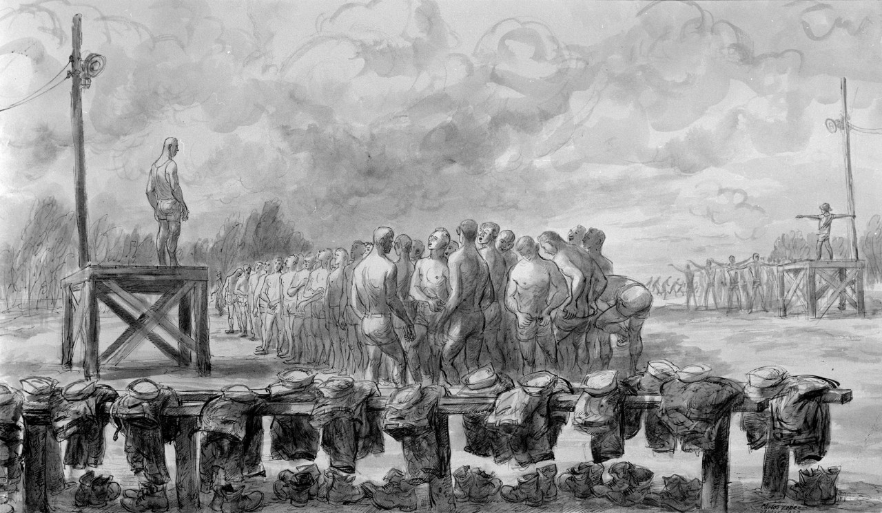 Sailors lined up in front of a man on a platform