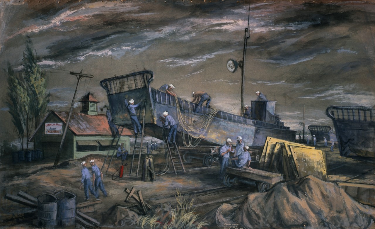 Sailors working on a landing craft in dry-dock