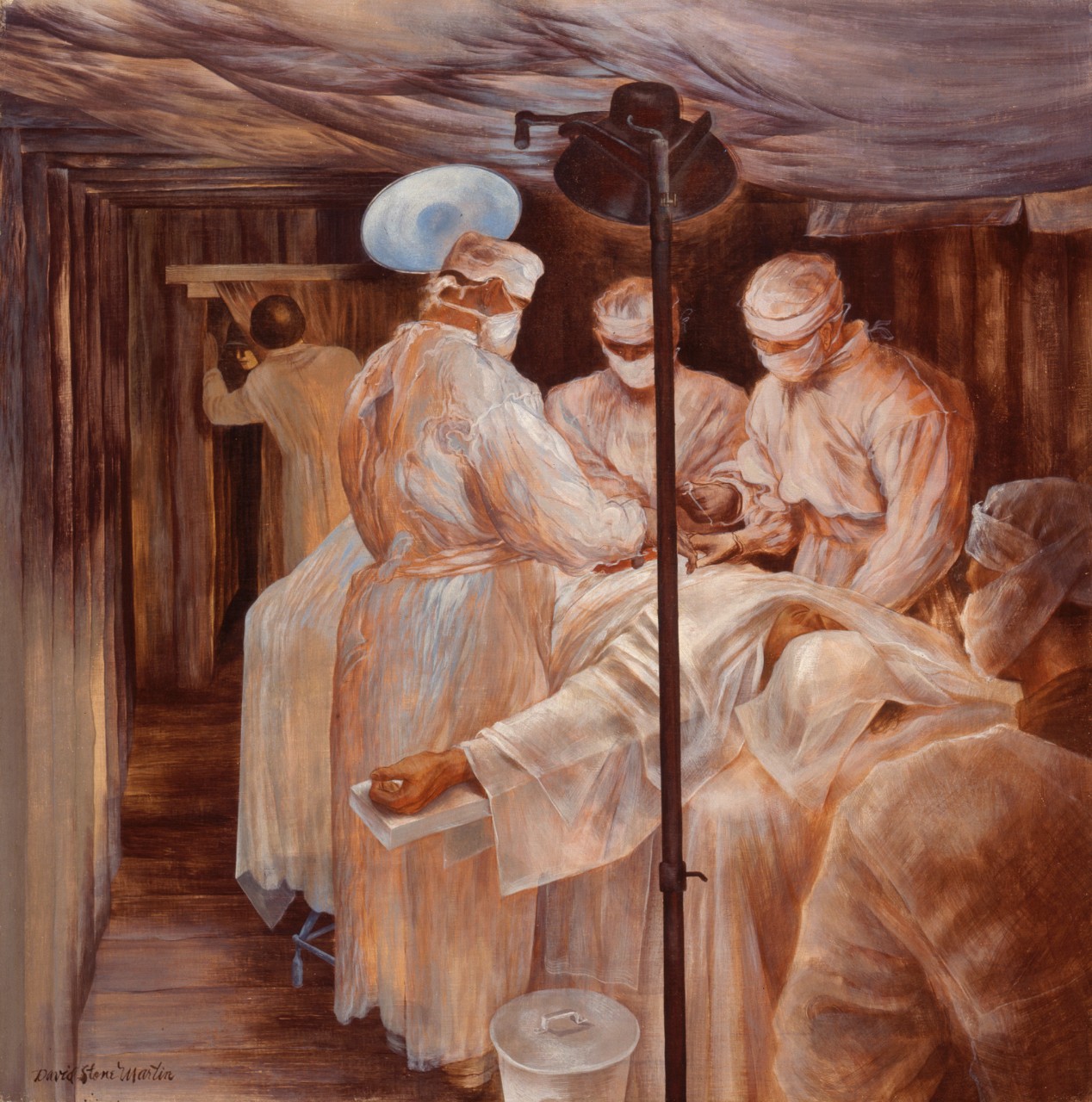 A team of medical personnel in the operating room working on a patient