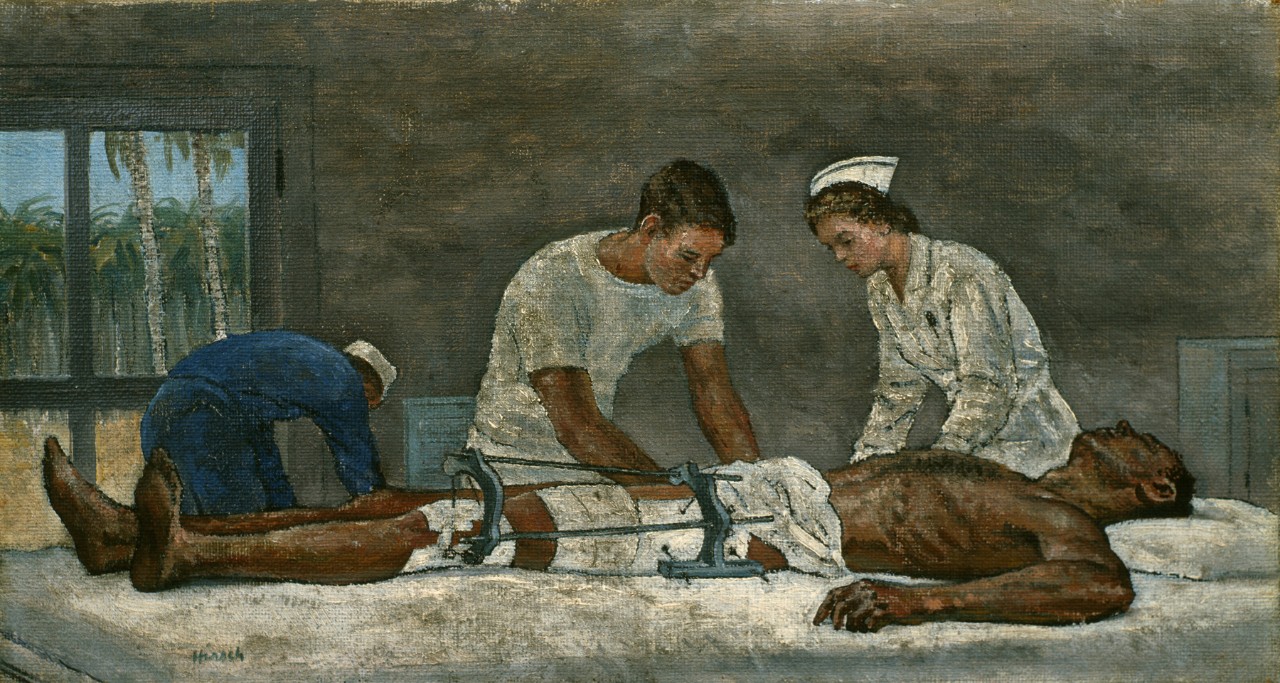 A navy nurse and a corpsman tend to a man with injured leg