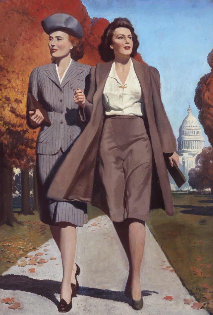 Two women walk in front of the U.S. Capitol