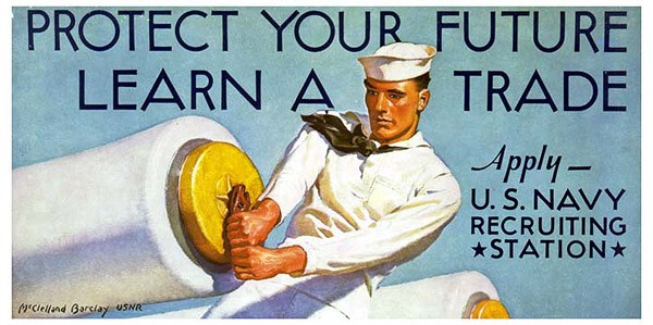 A sailor prepares a gun for firing