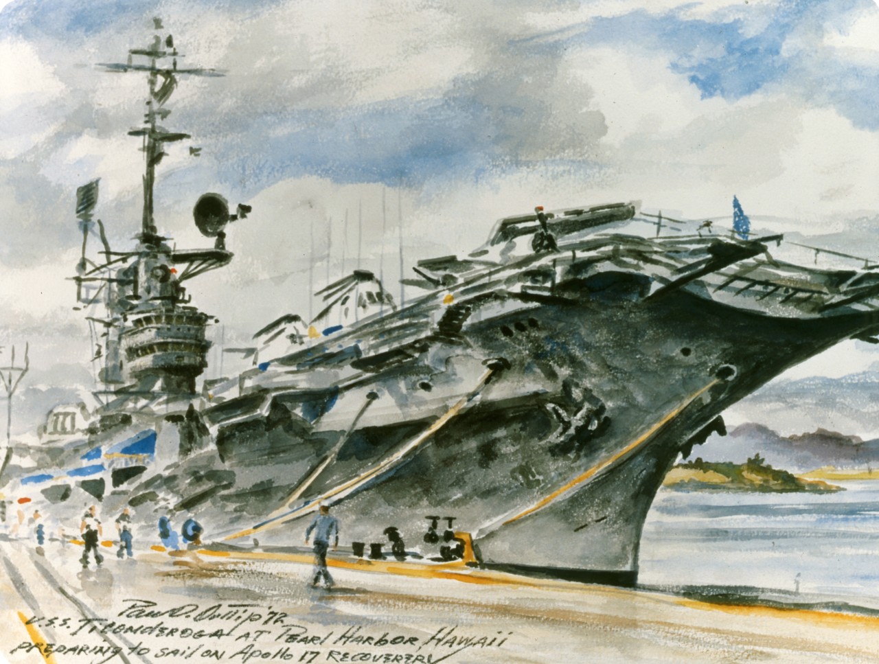 An aircraft carrier tied to a pier 