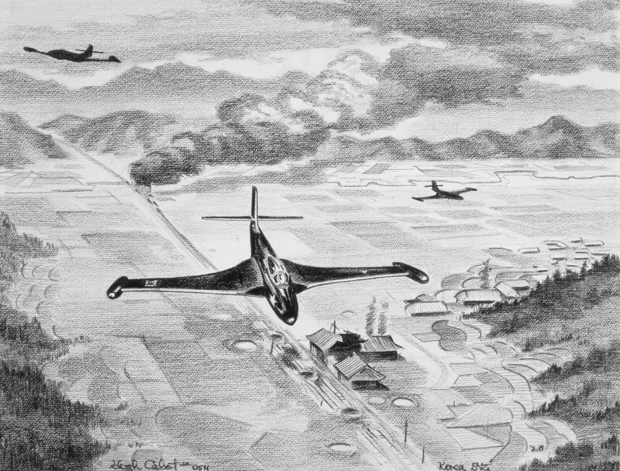 Two American jets fly down a valley with a plume of smoke in the background