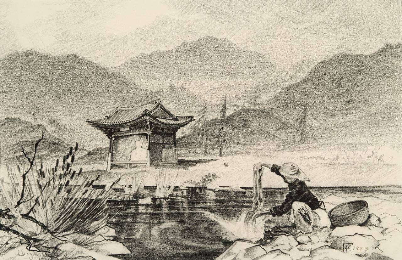 A temple is in the background while a woman washes her clothes in a river.