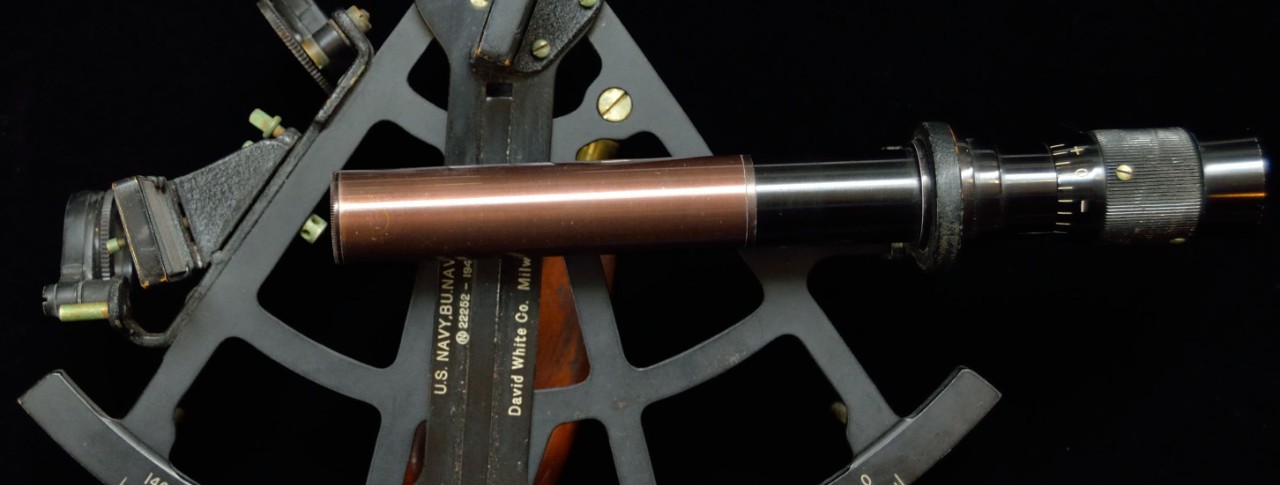 Close up view of Navy Sextant black metal and copper highlights