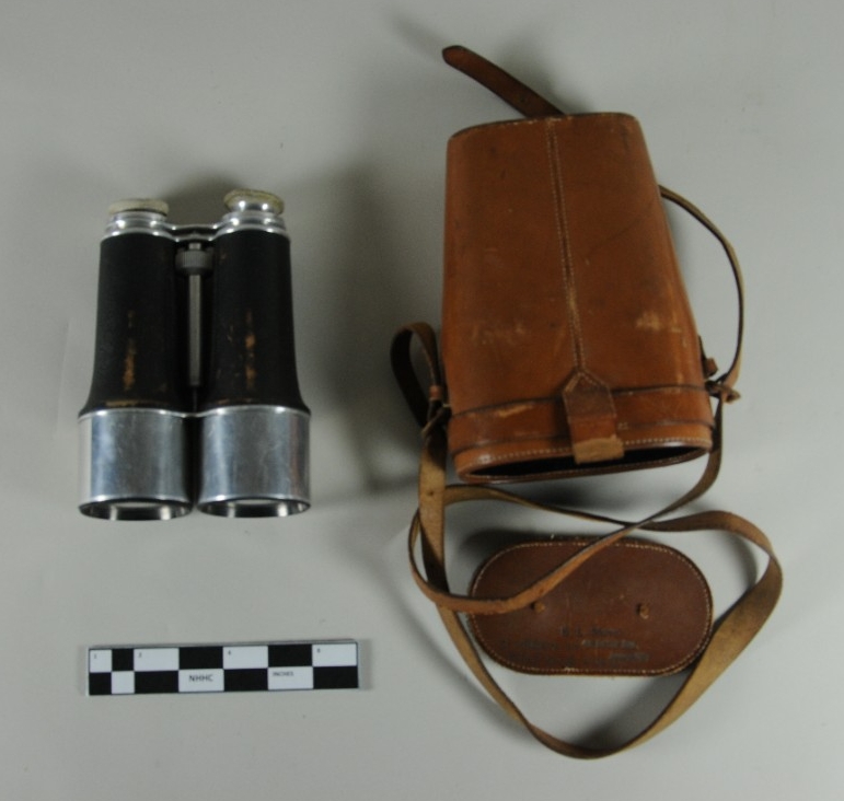 Black and silver binoculars with a leather and felt case