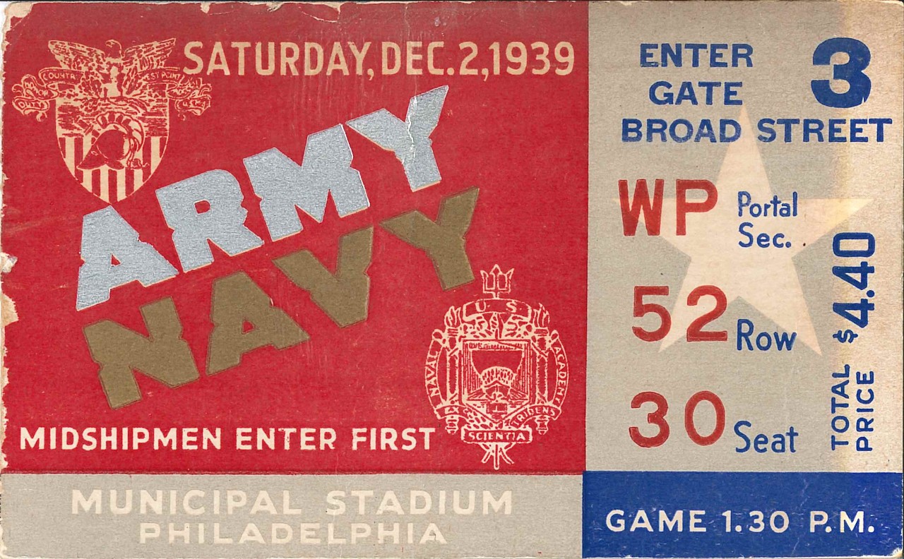 <p>Ticket has school seal from West Point in upper left corner and seal of Naval Academy in lower right corner. Lower left corner reads &quot;Midshipmen enter first / Municipal Stadium / Philadelphia&quot;. Right side lists &quot;Enter Gate 3 / Broad Street / Row 52, Seat 30 / Game 1:30 P.M. / Total Price $4.40.&quot;</p>