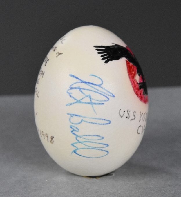 One egg, emptied of its contents, painted and signed. The side is signed by Dr. Robert Ballard.
