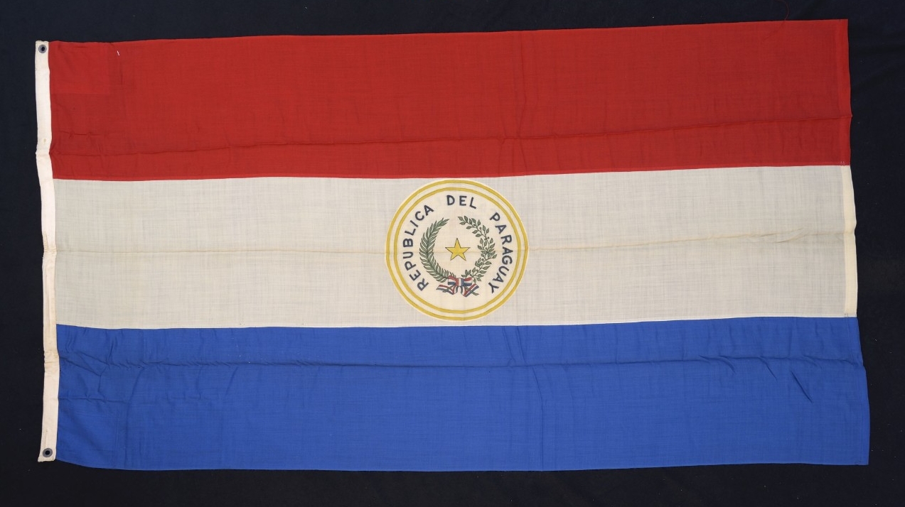 flag of Red white and blue horizontal bars with the crest for the Republic of Paraguay in the center white field