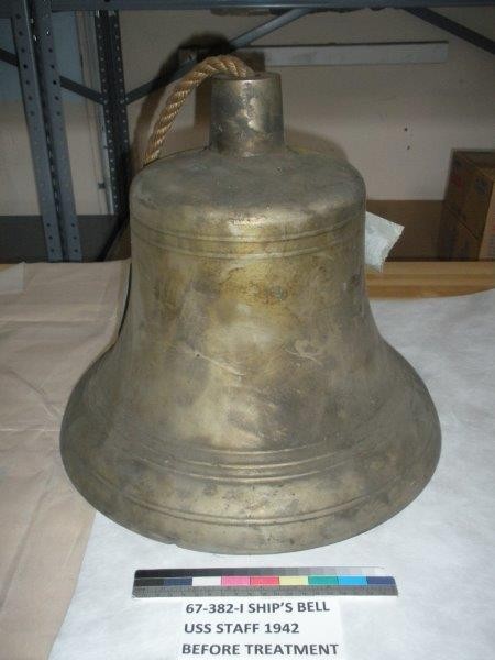 Brass Ship bell heavily tarnished with rope along the top.