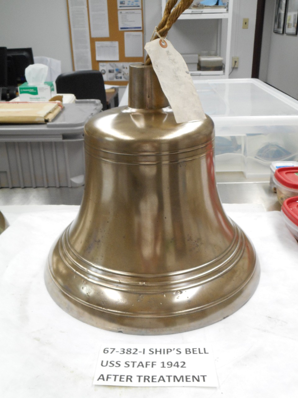 Ship's bell from USS Staff. Bell is shiny brass.