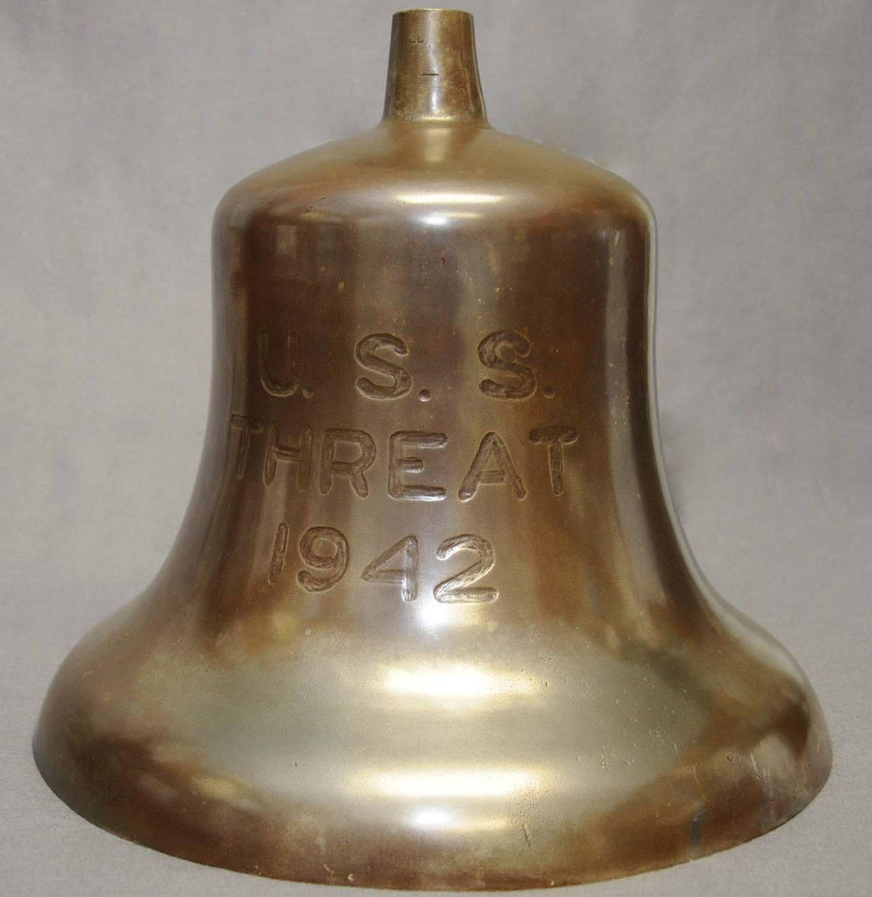Brass bell engraved with the text U.S.S. Threat 1942
