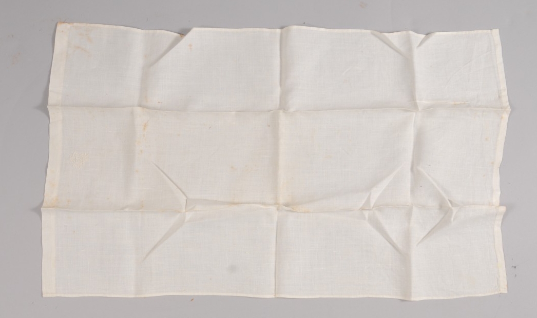 <p>White folded cloth from Finch chaplains kit</p>
