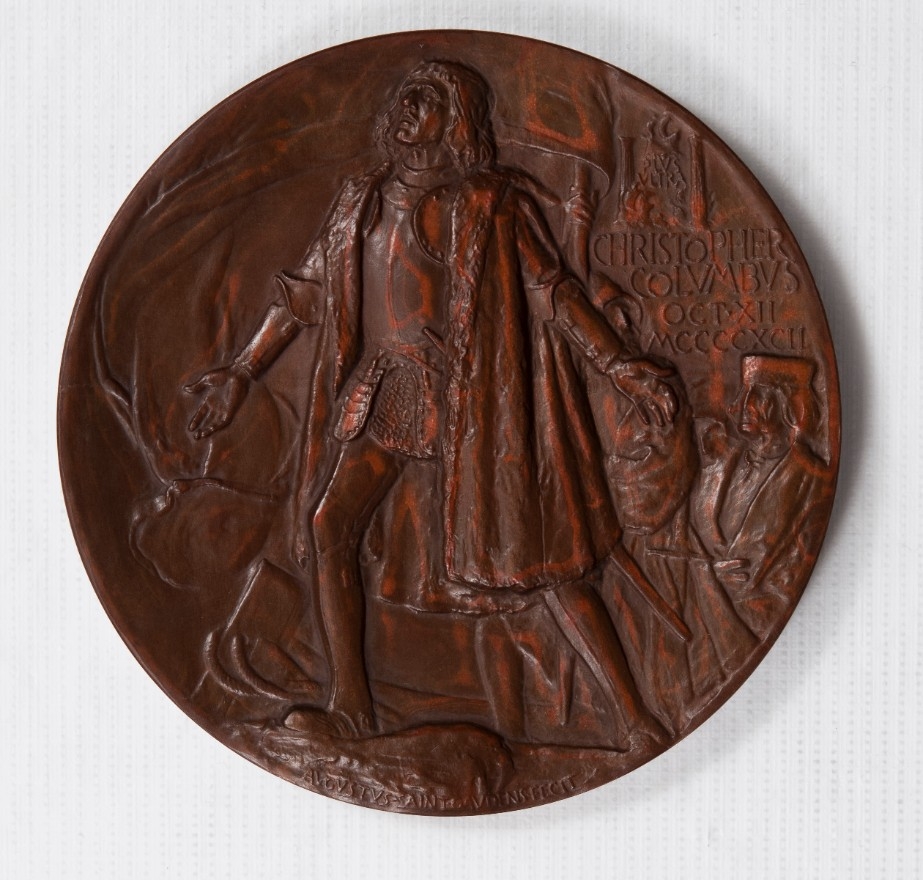 Obverse view of World's Fair 1893 medal depicting columbus putting his foot on the new world with arms opened
