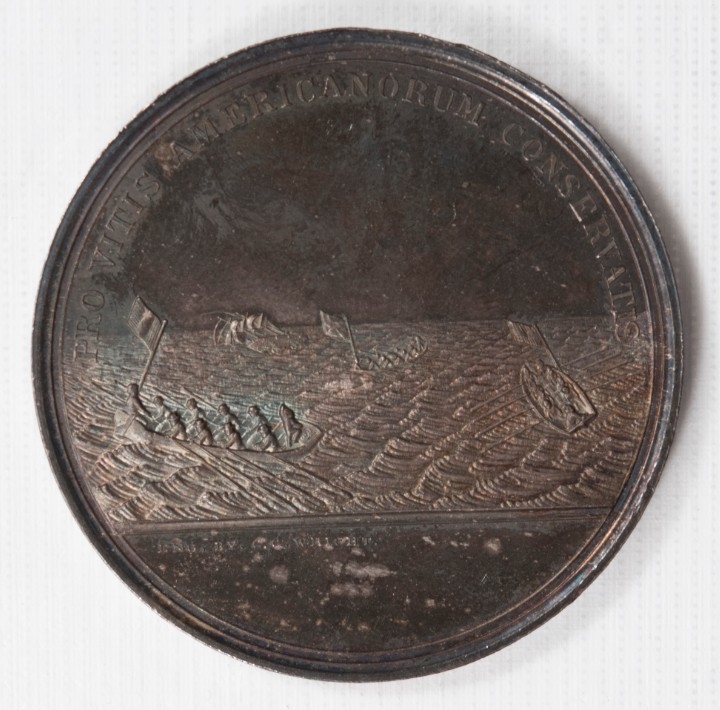 silver electroplated medal with latin text and depicting of the sinking of the ship USS Somers in 1846
