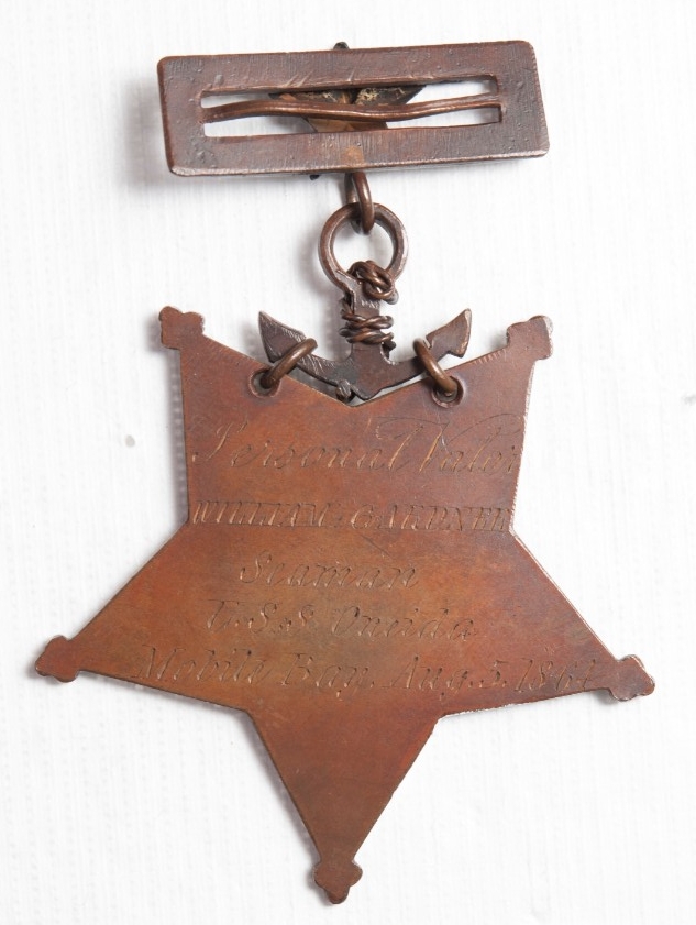 <p>Reverse view of medal of honor of William gardner showing engraving</p>

