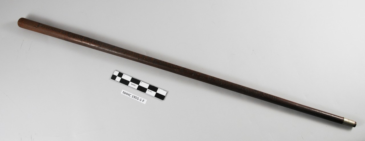 Wooden cane with old english script throughout