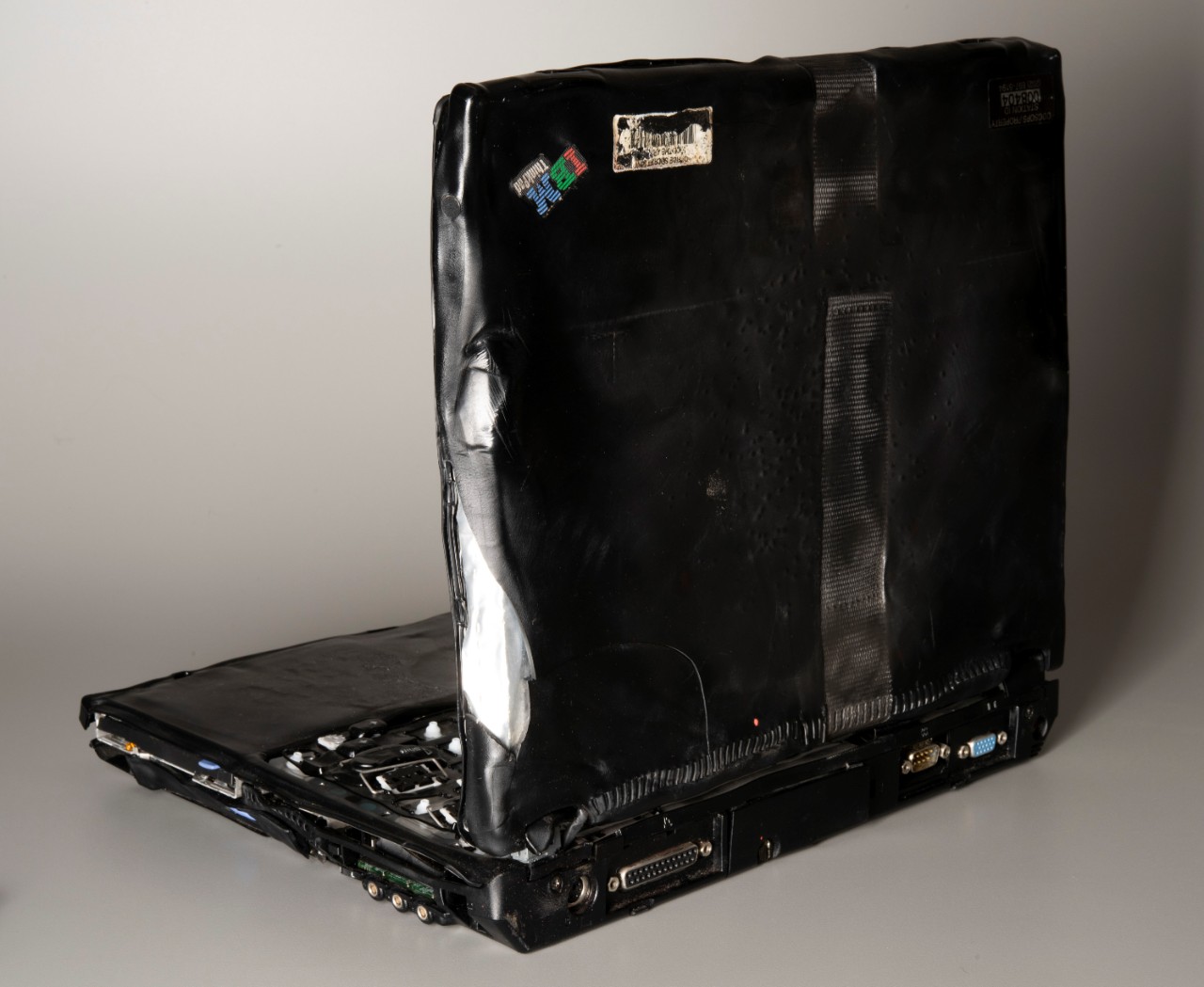 Heat damage from the fire after the attack on the Pentagon caused thermoplastic components to melt, warp, and keys to separate from the base of the laptop. Additionally, heat formed an impression of a security strap on the exterior of the laptop ...