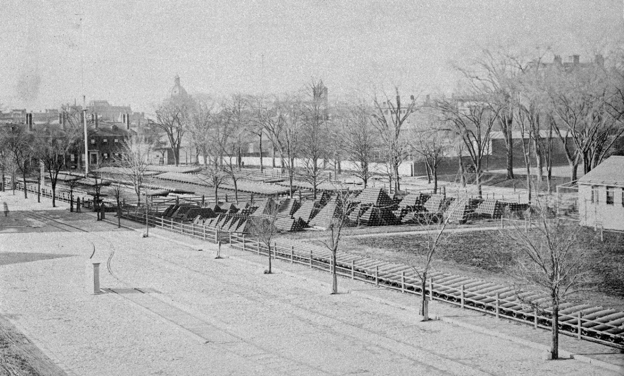 22 oversize photos, mounted on cardboard, showing scenes at the Boston Navy Yard, circa 1876. Primarily exterior views of buildings and shops. Marine barracks. Waterfront views, ships seen include: USS Vandalia, USS Tallapoosa, USS Wabash, USS Ohio, USS Niagara, USS Alert, USS Iowa (ex-Ammonoosuc), USS Connecticut (ex-Pompanoosuc), and USS Pennsylvania (ex-Kewaydin). Most photos have been assigned NH numbers.