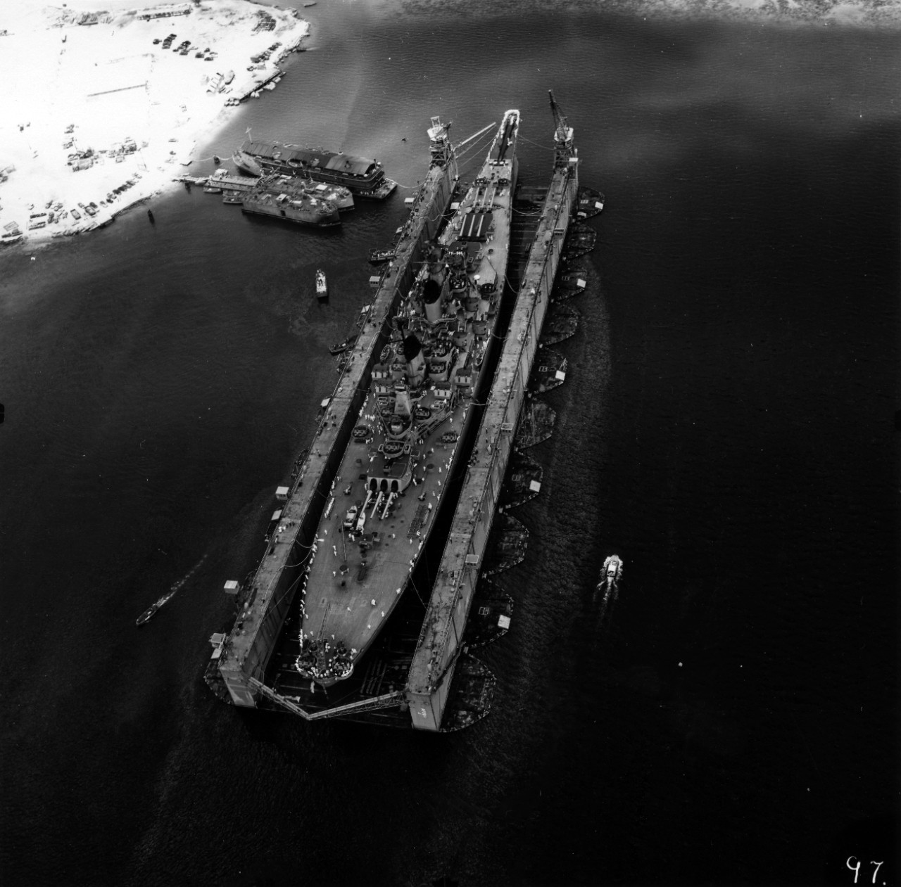 S-073 Captain Church Chappell Collection 143 photos of activities at Naval Operating Base Guam, 1951-1953. Sequence showing battleship USS Wisconsin (BB-64) entering Auxiliary Drydock AFDB-1, April 1952. Visit of Brazilian Naval Cadet Training Ship N.E. Almirante Saldanha to Guam, October 1952. Social functions and parties on Guam, 1952.
