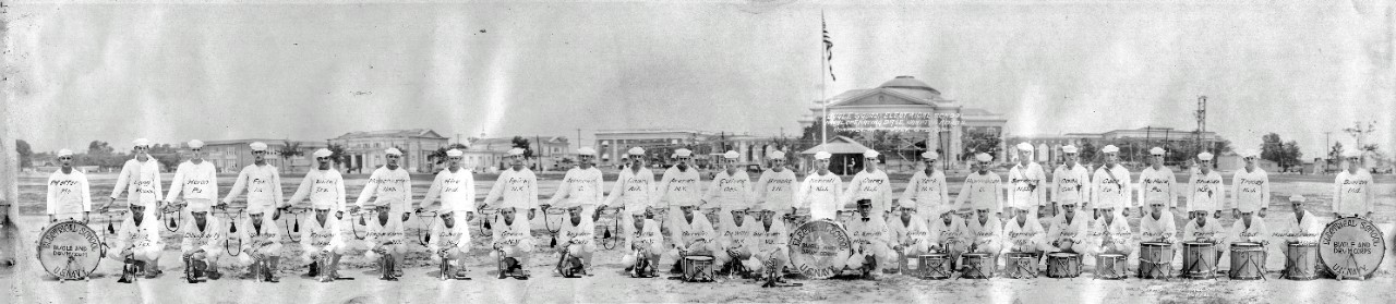 <p>Single oversize panoramic image of the US Navy Drum and Bugle Corps at the Hampton Roads Electrical School, July 6, 1918. Each individual is identified in the photograph by their last name as well as their state of residence.</p>