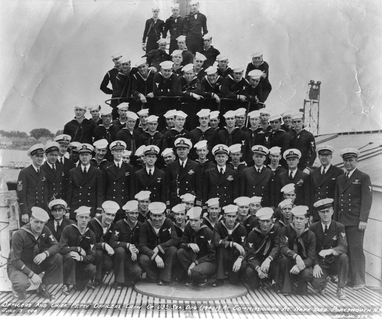19 black and white photos from the service of Francis Philip Goodwin during World War II, donated by his family. Focus is U.S. Navy submarines and submarine life. Shown are the launching of USS Sea Dog (SS-401) as well as her commissioning crew and a party celebrating the event. Launching photo is alternately labeled USS Segundo (SS-398), leading to some confusion on identification. Photos of sailors on deck of USS Pilotfish (SS-386) alongside USS Proteus (AS-19) at Yokusuka. Deck guns can be seen, as well as the boat’s dog mascot.