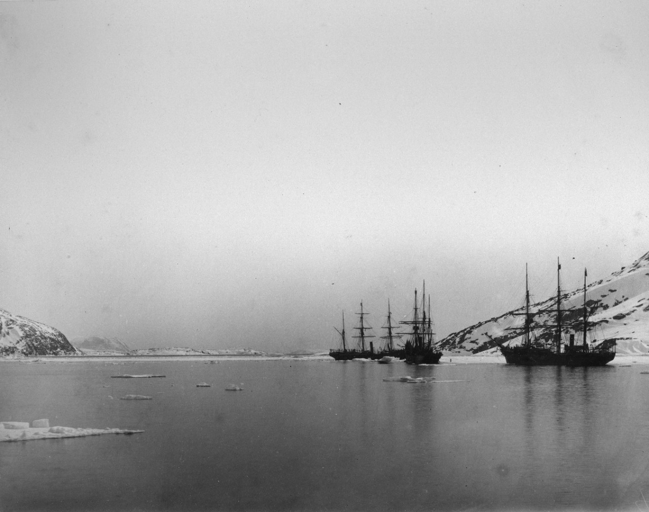 317 black and white and sepia photographs mounted on cardboard, showing the 1884 U.S. Navy expedition, led by Captain Winfield Schley, to rescue the stranded U.S. Army mission exploration mission commanded by Lieutenant Adolphus W. Greely, the Lady Franklin Bay Expedition. Ships seen include USS Thetis, USS Bear, USS Alert, Loch Garry, as well as numerous whalers. Many locations in Greenland, Newfoundland, and New Hampshire, with dramatic ice and snow landscapes. Good images of local population. Views of equipment used in the expedition, in particular various types of sleds. Much of this imagery overlaps with the USN 900000 series. Some photos have also been assigned NH numbers.