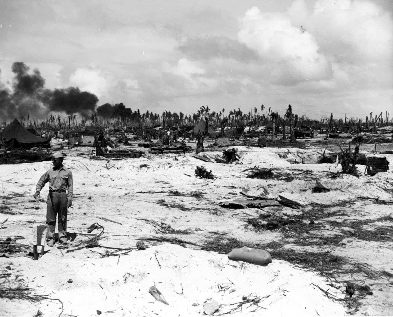 Destruction of Japanese defenses on Makin Island in the Gilbert after invasion, circa November - December 1943. From the VADM Robert C. Giffen Photo Collection. 