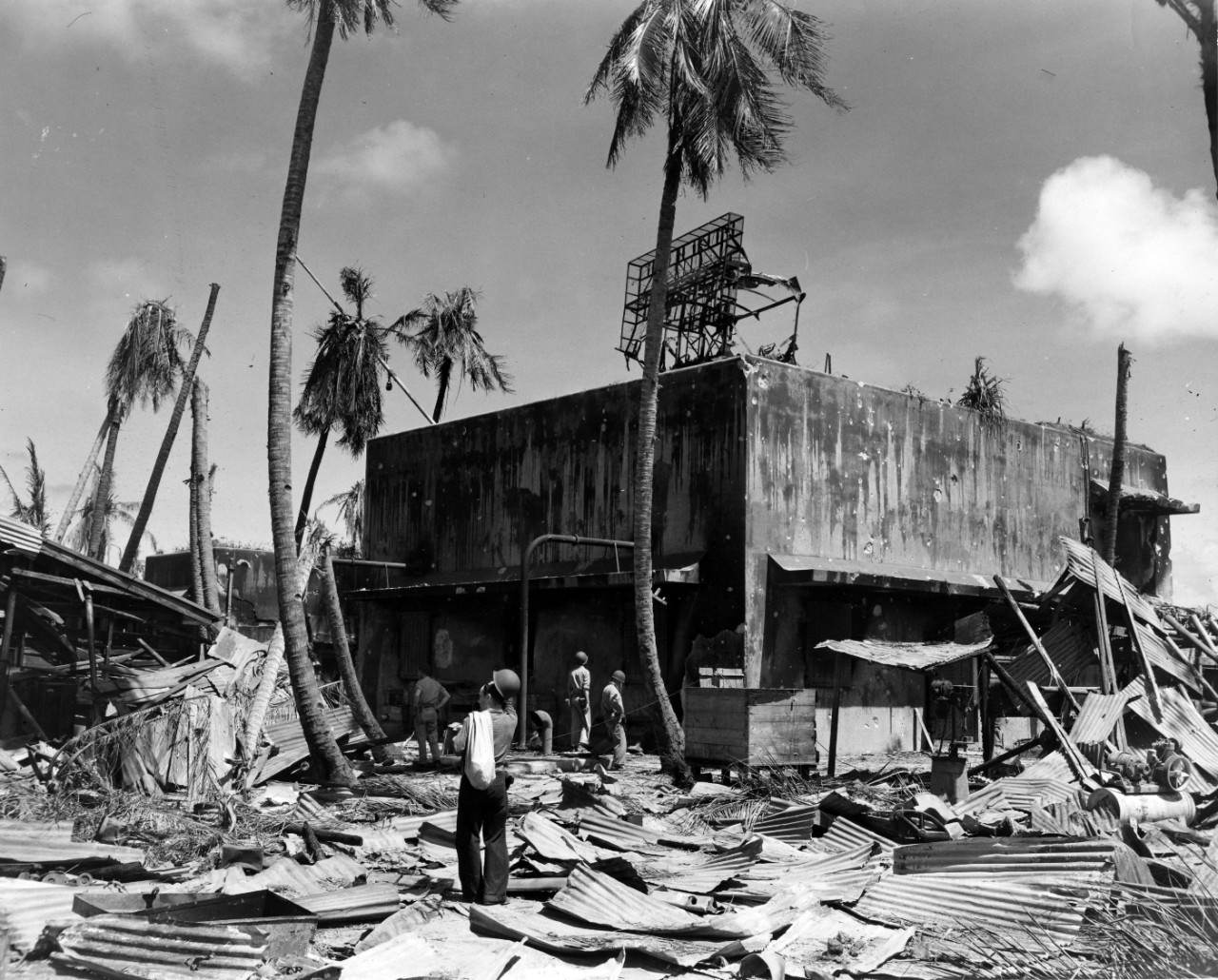 Sailors viewing the destruction of a bombed Japanese radar building on Kwajalein, February 1944. From the VADM Robert C. Giffen Photo Collection. 