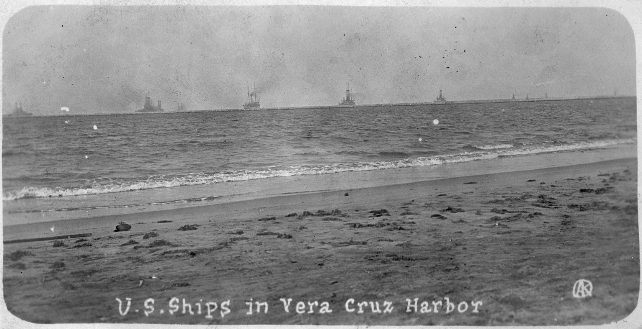 50 black and white and sepia postcards of events taking place during the donor’s paternal grandfather Michael Kush’s service on board USS Florida (BB-30) and USS Arizona (BB-39) from 1912 to 1920. Scenes at Veracruz, Mexico 1914 including Mexican casualties, sailors ashore, damage to buildings, warships offshore, and funeral procession in New York. US Navy warships underway and in various ports including Constantinople, New York, and Smyrna. Many views of battleships including USS Virginia (BB-13), USS Arizona (BB-39). Other ships include USS Vestal (AR-4), USS Manley (DD-74), and unidentified foreign warships. Gatun Locks of the Panama Canal. Scenes on board a battleship, including inspection, posing with a trophy, games, boxing, washing mess tables, and target practice. World War I including German prisoners at Rheims, France; disabled German tank; man posing with Great War council vote headline.