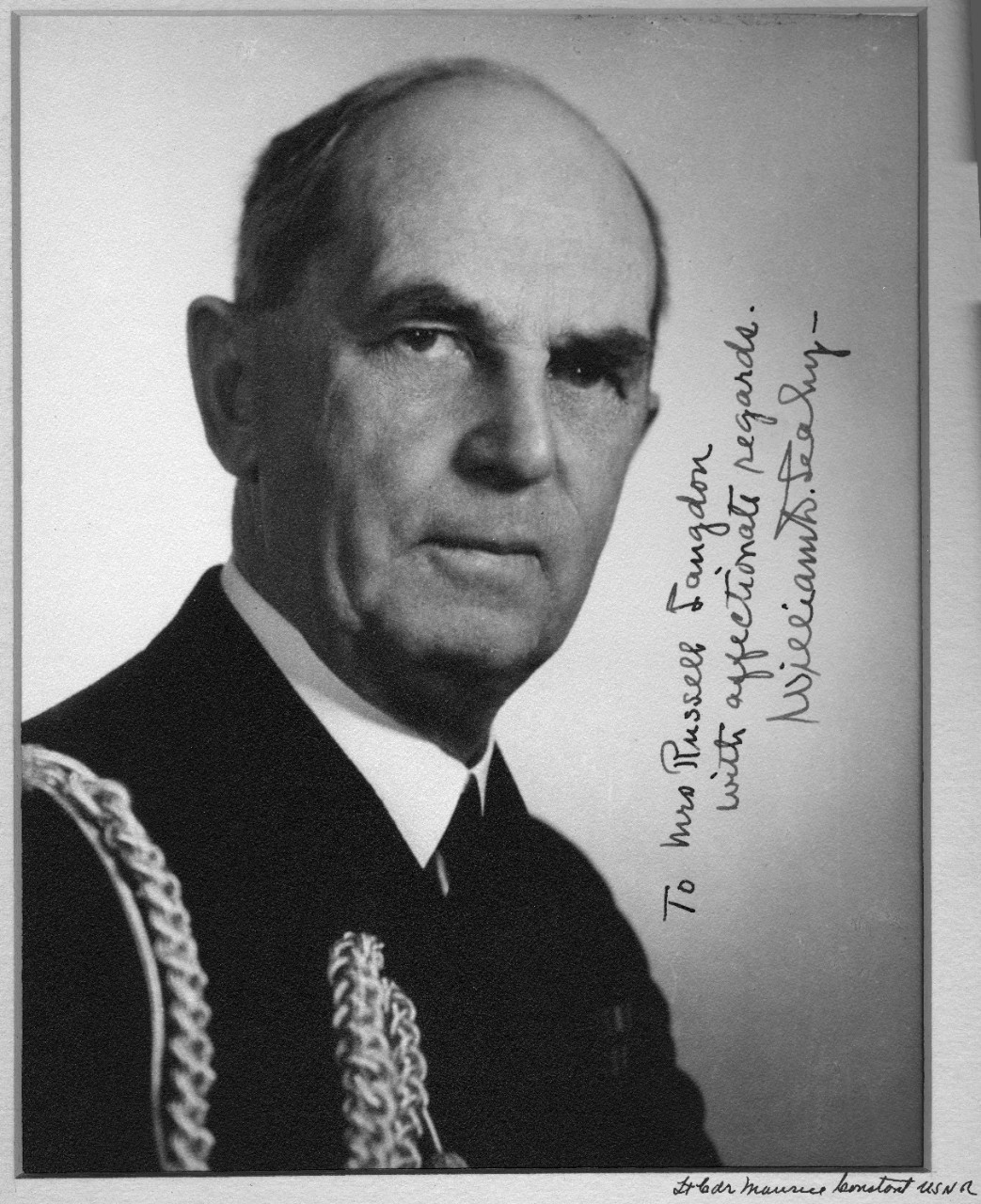 Autographed black and white photo of Fleet Admiral William Leahy, donated to the Naval Historical Foundation in 1964 by Commander Edward S. Mole. Autograph is made out to Mrs. Russell Landon. Photographer may be Lieutenant Commander Maurice Constant.
