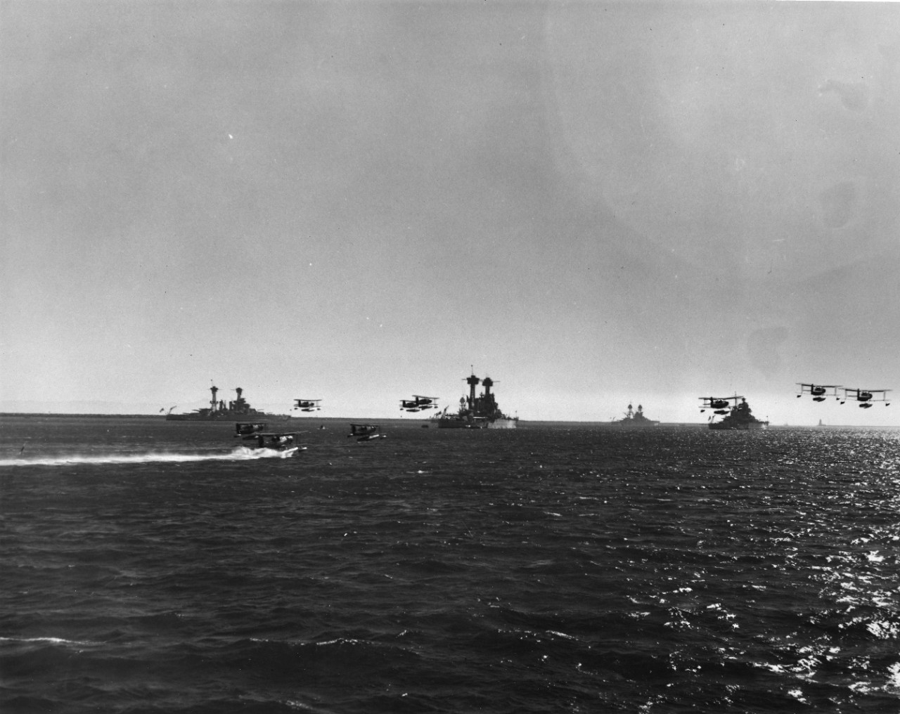 16 black and white images showing U.S. Navy and merchant ships just before World War II.  USS New Mexico (BB-40); USS Erie (PG-50); USS Minneapolis (CA-36); USS Fresno (CL-AA-121); USS Porter (DD-356); USS Idaho (BB-42); USS Augusta (CA-31); USS Honolulu (CL-48); USS Dale (DD-353); USS Pike (SS-173); USS Babbitt (DD-128); USS S-1 (SS-105); Fleet Review honoring American Legion circa 1939, with battleships and Douglass TBD-1 Devastators and Curtiss SOC Seagulls; launchings of SS Marina and SS Manhattan, with tug N.C. Jefferson.  1 image removed to the NH collection.