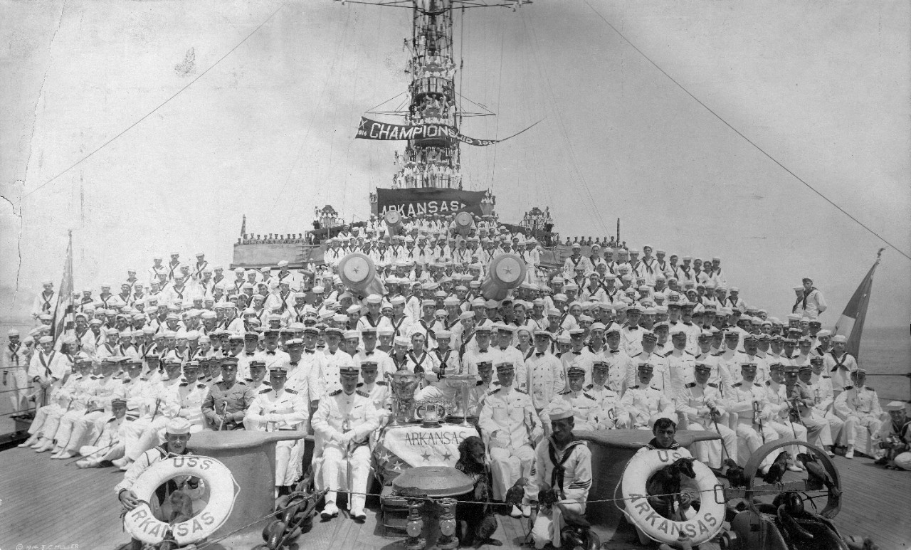 36 photos, primarily oversize prints, showing 20th century crew photos. National Rifle Association team and US Atlantic Fleet team, Australia 1908; naval training station sailors at parade rest; officers on board USS New Hampshire (BB-25) including Admiral William Cowles and Lieutenant Commander David Sellers; officers on board USS St. Louis (C-20); crew of USS Iowa (BB-4); officers at Naval Hospital Mare Island 1921 including Captain Ammen Farenholt; Belgian Corps of Engineers; class of 1904 St. Paul’s School for Boys possibly showing future Vice Admiral Theodore Wilkinson; officers USS Illinois (BB-7); officers USS Michigan (BB-7) 1910 including Lieutenant Commander David Sellers; naval cadets 1905 at receiving barracks; USS Albany (CL-23) 1910 including Lieutenant Commander William Standley; group photo, US Naval Home in Philadelphia beneficiaries 1920; group photo of admirals taken at the home of Spencer Wood, also seen are John Halligan, Harris Lanning, Dion Williams (General USMC), Clark Woodward, J.H. Dayton, A.W. Marshall, Harley Christy, J.P. Parker (Commodore), James Glennan, William Caperton, C.P. Kindleberger, Bradley Fiske, William Leahy, C.S. Kempff, George Marvell, Clarence Williams, L. Hunt; unidentified boxing match in an auditorium; photos cadets at Naval Academy circa 1909; signal corps on board USS St. Louis (C-20); panorama of unidentified formal dinner; montage of images from Naval Training Station San Diego, Captain David Sellars commanding; officers and enlisted who attended funeral of Mexican Minister at Vera Cruz 1905; full crew of USS Arkansas (BB-33) circa 1914 with mascot, baseball championship pennant flying, awards, and trophies; Camp Perry 1908; officers USS Texas (BB-35); Naval Training Station San Francisco 1913; officers USS Chicago; Admiral Cameron Winslow with the Vanderbilts and a German admiral; officers USS Essex; Post Commanders (Employment Committee) Department of the Potomac, G.A.R. 1905; 2nd Hague Conference 1907. Some photos have been assigned NH numbers or removed to the NH collection.