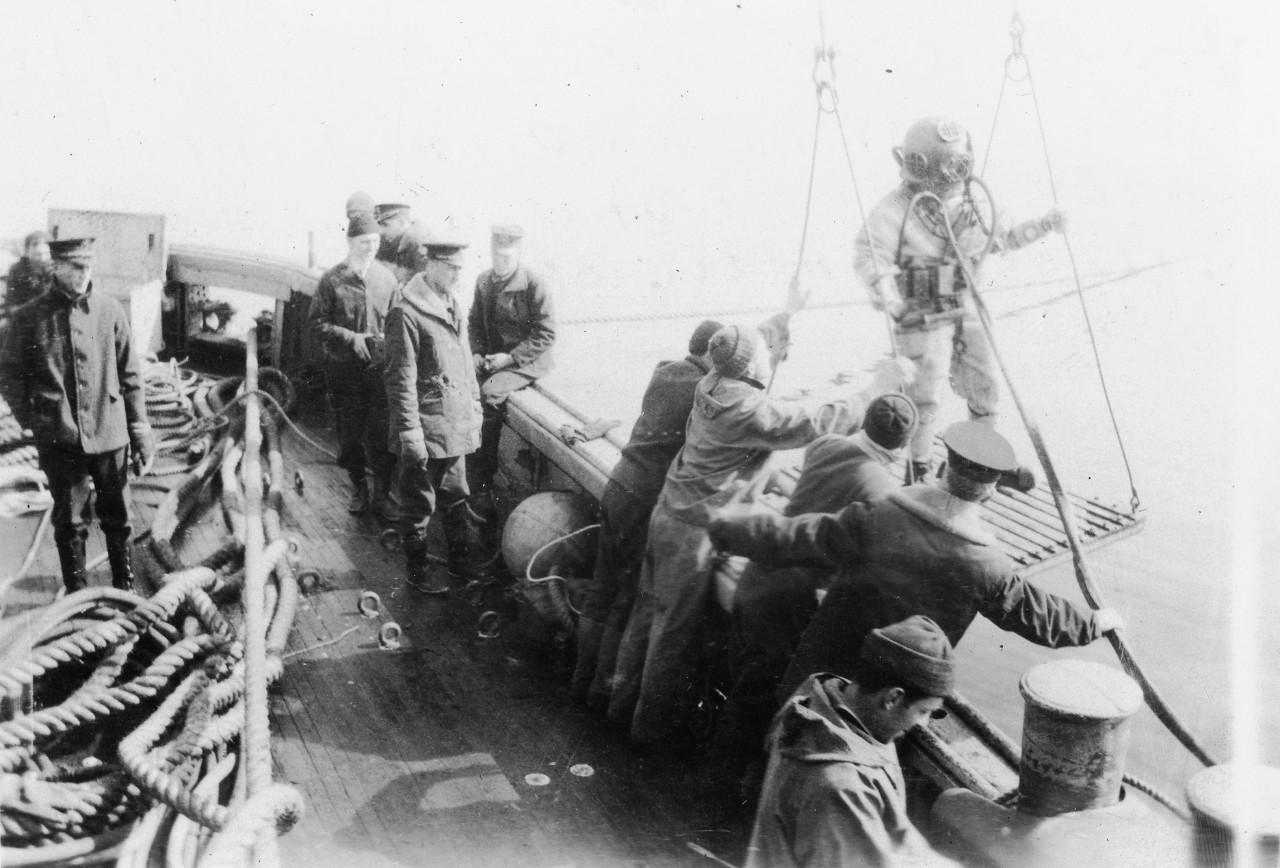 Diving operations during salvage of S-4. Officer behind lines on deck may be Captain King (later fleet admiral). he was in overall charge of salvage operations.  