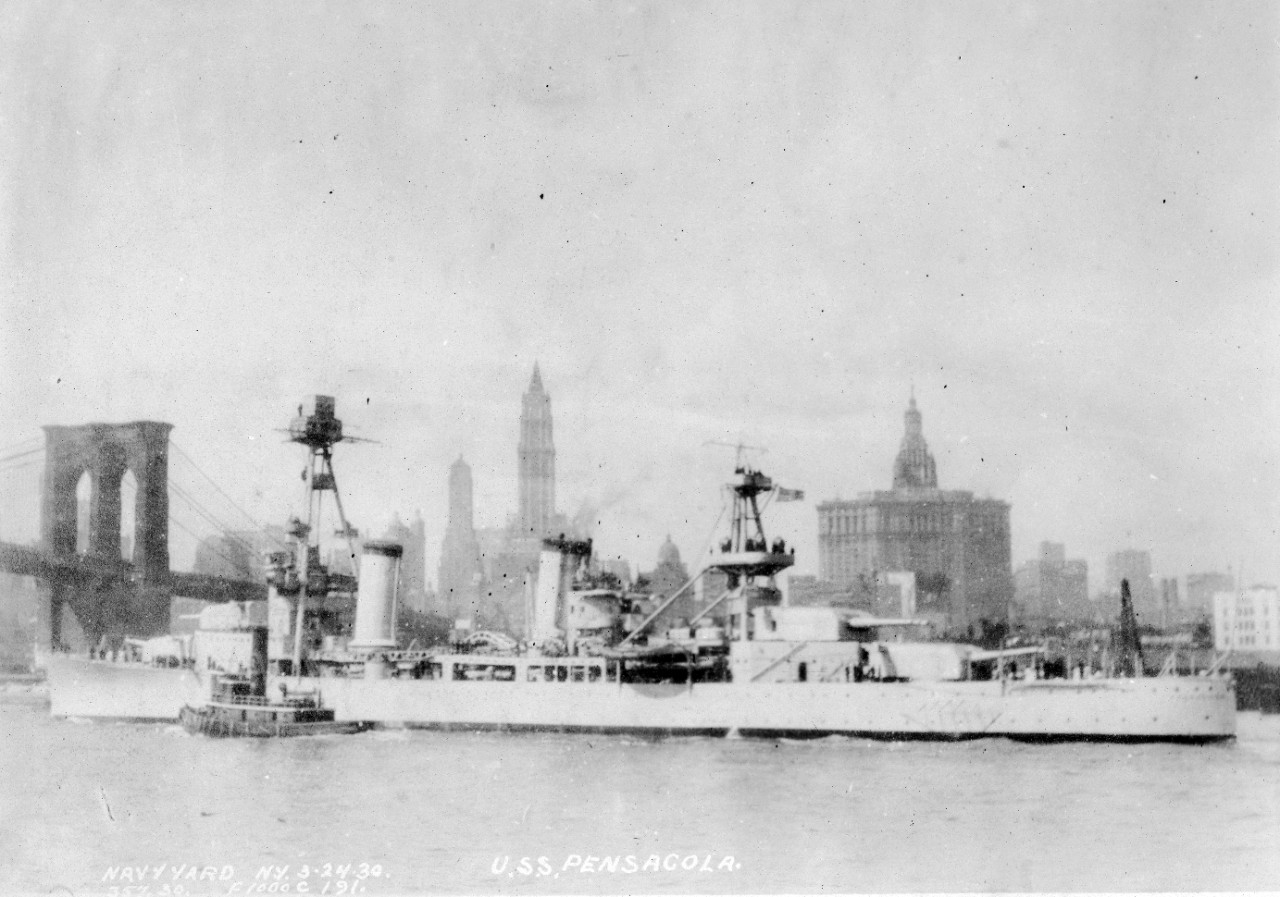Collection of 103 photographs of and on USS Pensacola taken by the New York Navy Yard and dated March 24, 1930. The images were part of an album held by the Bureau of Ships Drafting Office. Specific imagery consists of: USS Pensacola in New York Harbor; interior spaces (such as radio office, gallery, pantry, chart house, quarters, supply rooms, boiler and engine rooms, central control spaces etc.); weapons and ordnance; structural details such as welding details, stiffeners, beams; furnishings; equipment (tripod masts, motor launches, winches, and pump); and general waterfront views of the New York Navy Yard. 